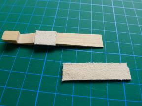 Aufgeleimtes Auslöser-Rückfallpolster